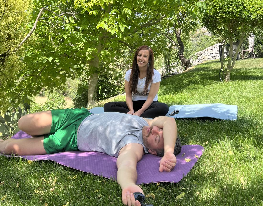 A somatic session on the grass beneath a walnut tree