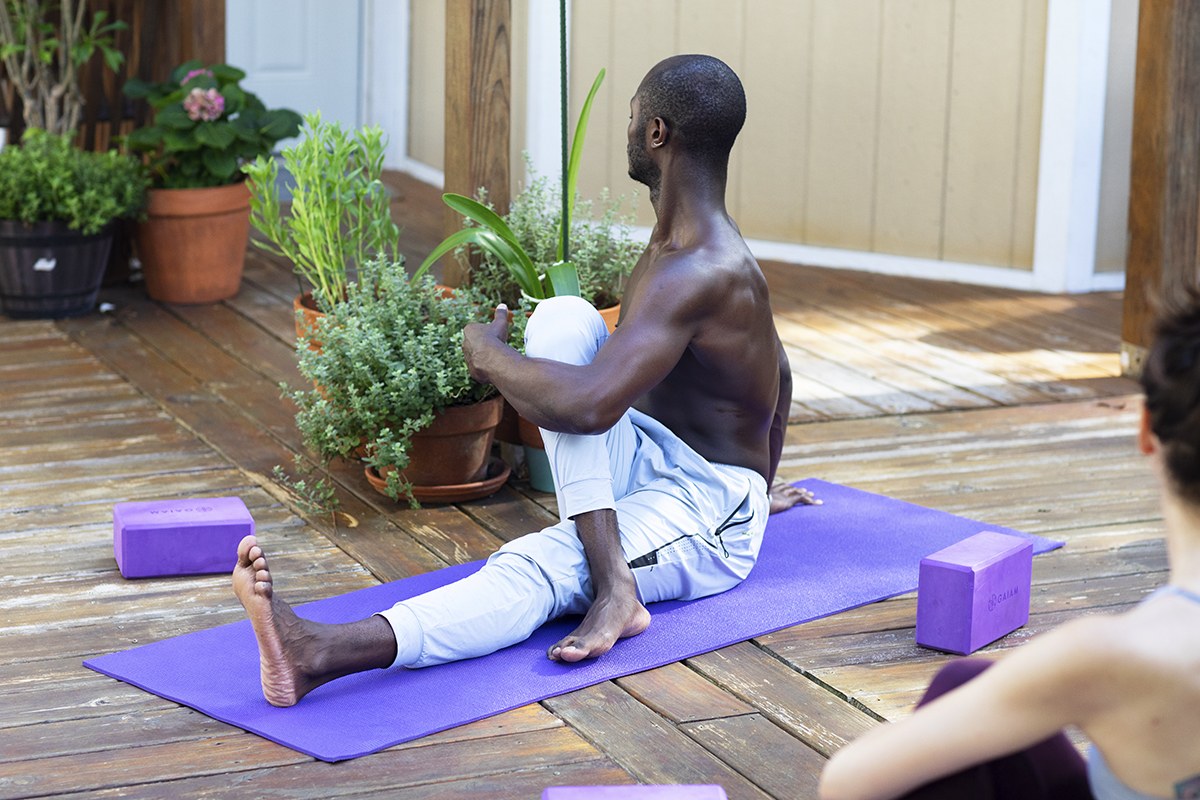 A seated spinal twist on the deck
